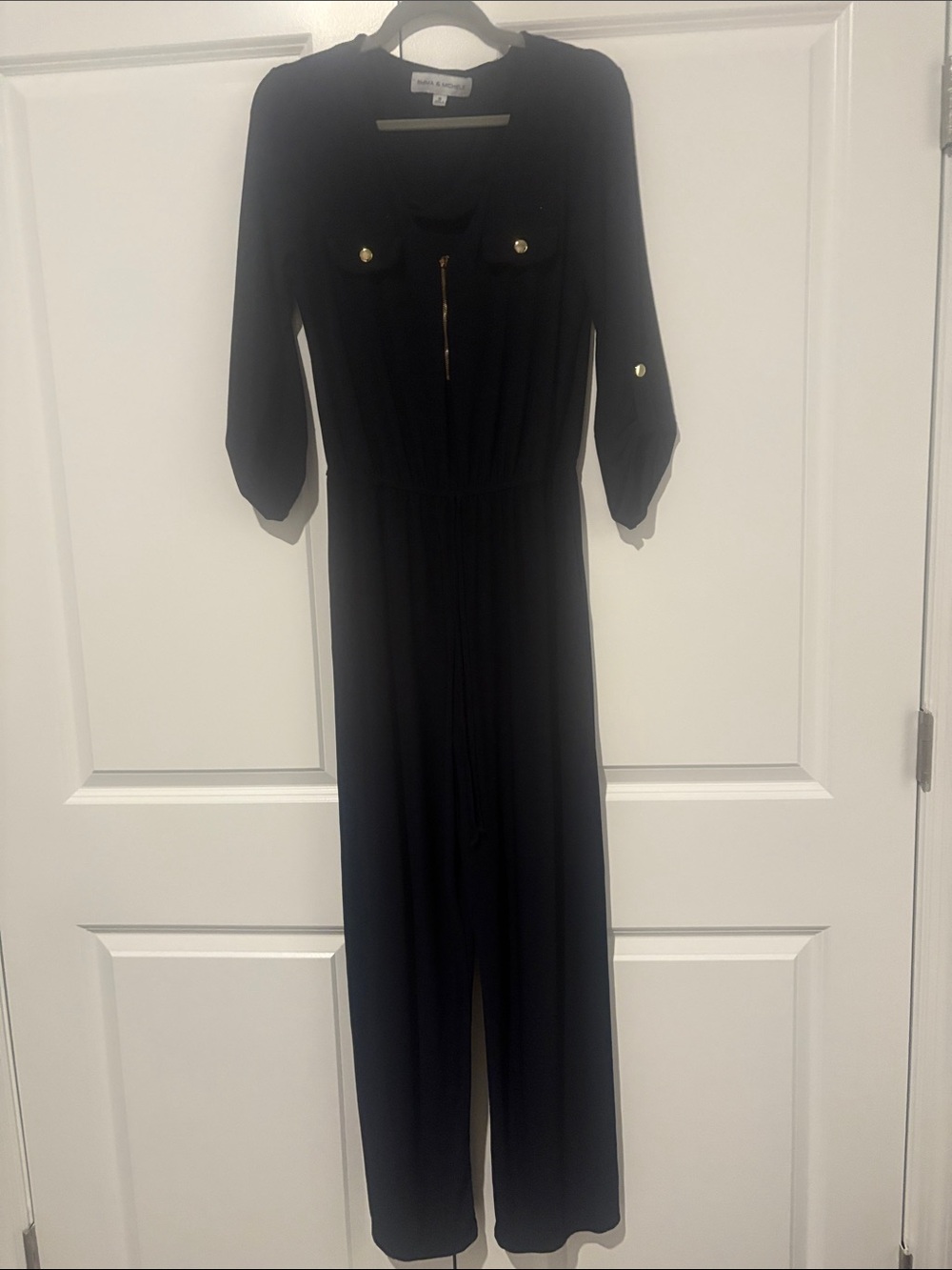 Emma & Michele Black Long-Sleeve Jumpsuit with Gold Hardware